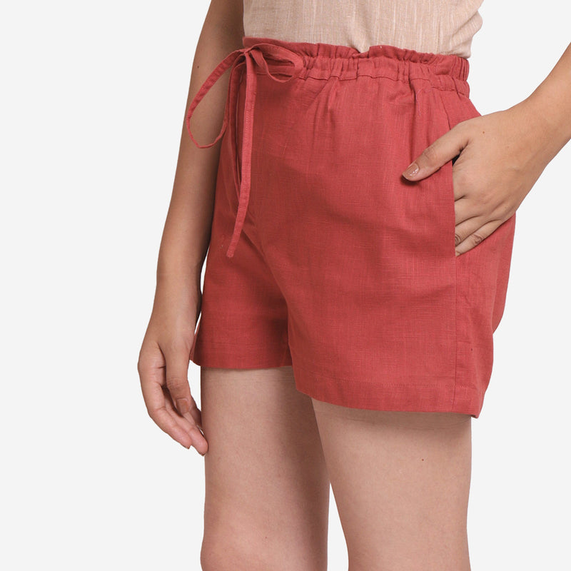Left View of a Model wearing Brick Red Cotton Straight Shorts