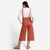 Back View of a Model wearing Brick Red 100% Cotton Pinafore Midi Dungaree