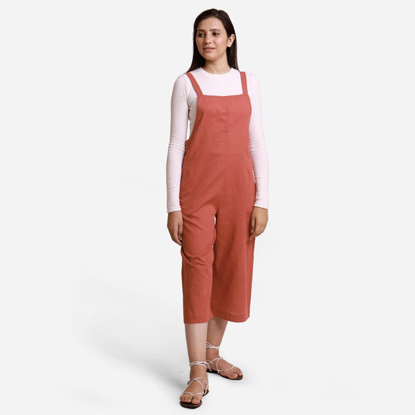 Front View of a Model wearing Brick Red 100% Cotton Pinafore Midi Dungaree