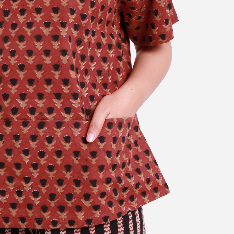 Front Detail of a Model wearing Brick Red Floral Block Print Straight Top