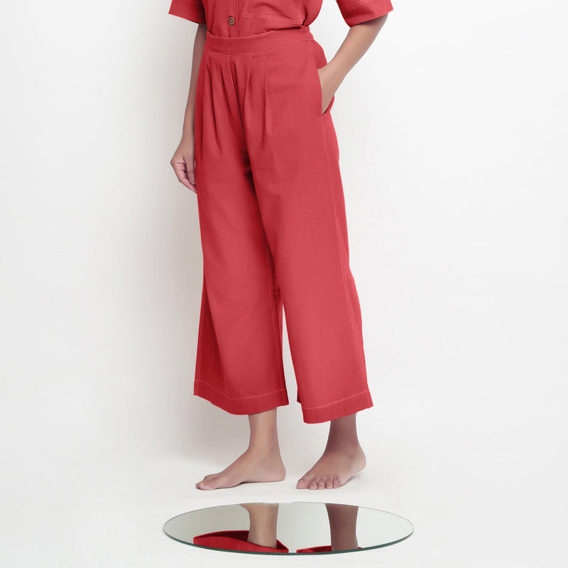 Left View of a Model wearing Brick Red Vegetable Dyed 100% Cotton Wide Legged Pant