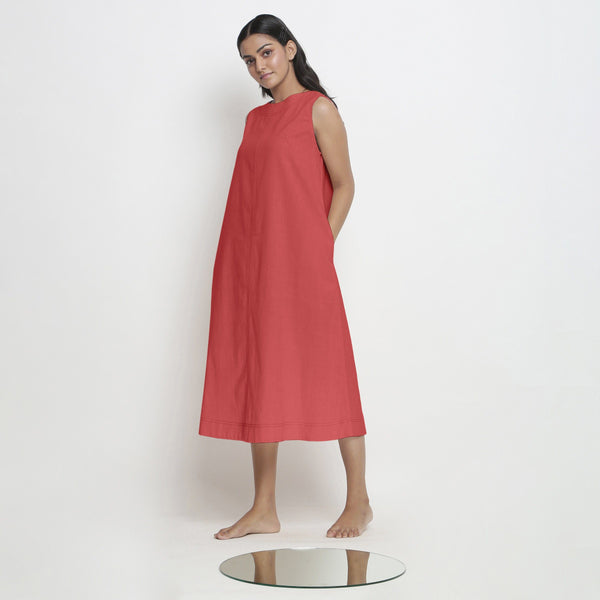Left View of a Model wearing Brick Red Vegetable Dyed A-Line Paneled Dress