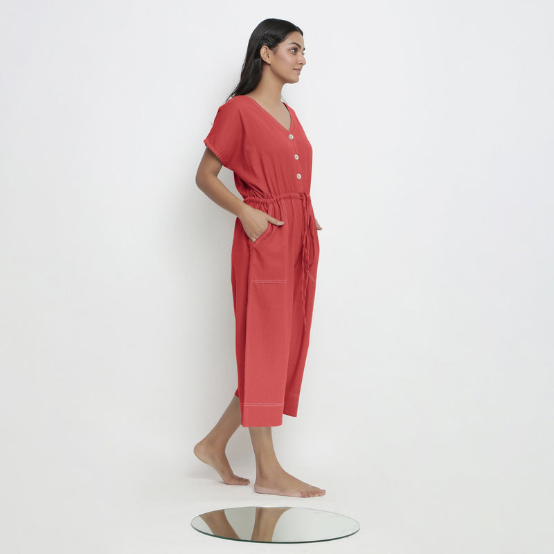 Right View of a Model wearing Brick Red Vegetable Dyed Button-Down Jumpsuit