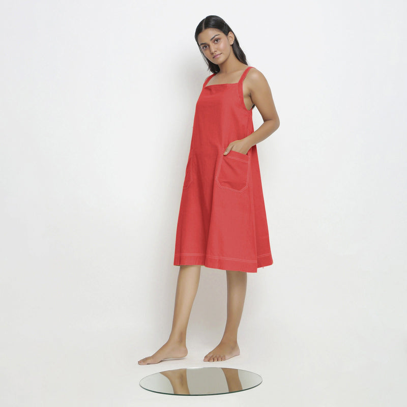 Left View of a Model wearing Brick Red Vegetable Dyed Handspun Slip Dress