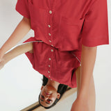 Front Detail of a Model wearing Brick Red Vegetable Dyed Romper