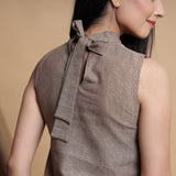 Back Detail of a Model wearing Brown and Beige Reversible Cotton Yoked Tie-Up Neck Top