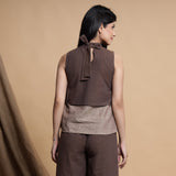 Back View of a Model wearing Brown and Beige Reversible Cotton Yoked Tie-Up Neck Top