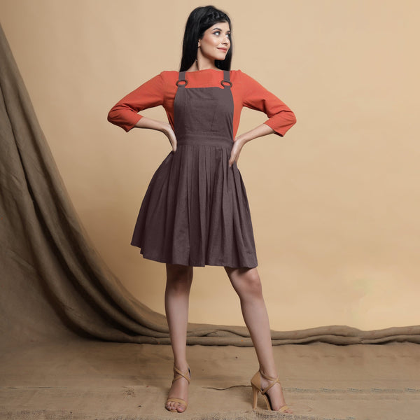 Front View of a Model wearing Brown Pleated Cotton Flax Knee Length Criss-Cross Back Dress