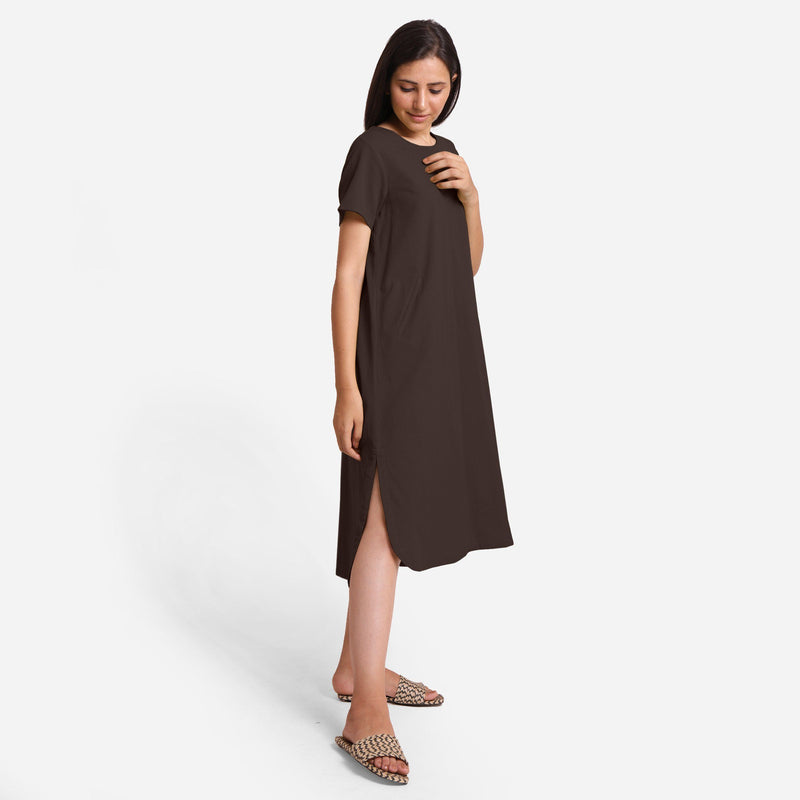 Right View of a Model wearing Brown Cotton Welt Pocket Shift Dress