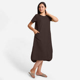 Front View of a Model wearing Brown Cotton Welt Pocket Shift Dress