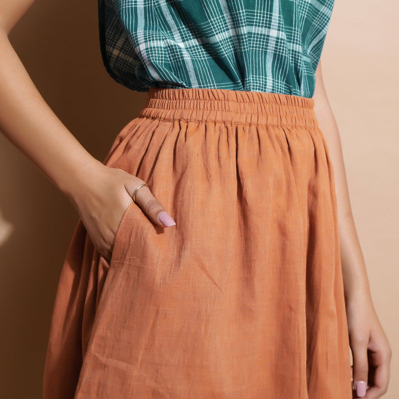 Right Detail of a Model wearing Brown Handspun Flared Knee Length Skirt