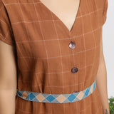 Front Detail of a Model wearing Brown Handspun V-Neck Shift Dress