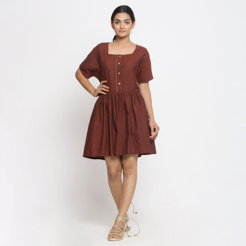 Front View of a Model wearing Brown Cotton Button-Down Gathered Dress