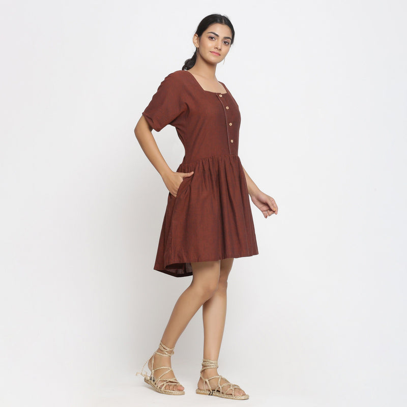 Right View of a Model wearing Brown Cotton Button-Down Gathered Dress