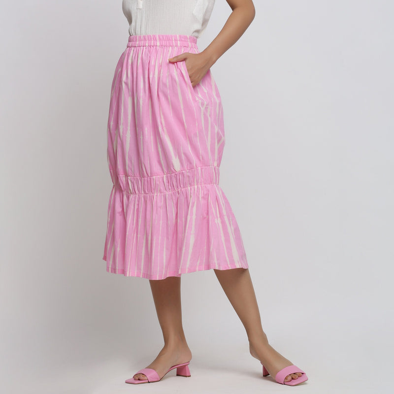 Left View of a Model wearing Bubblegum Pink Tie-Dye Cotton Elasticated Midi Balloon Skirt