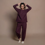 Front View of a Model wearing Burgundy Flannel Sweatshirt and Jogger Set