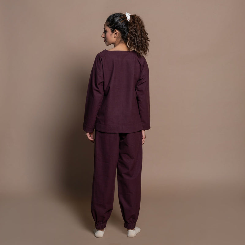 Back View of a Model wearing Burgundy Flannel Sweatshirt and Jogger Set