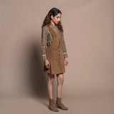 Right View of a Model wearing Camel Brown Cotton Velvet Pinafore Short Dress