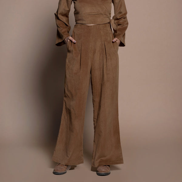 Front View of a Model wearing Camel Brown Cotton Velvet Elasticated Wide Legged Pant