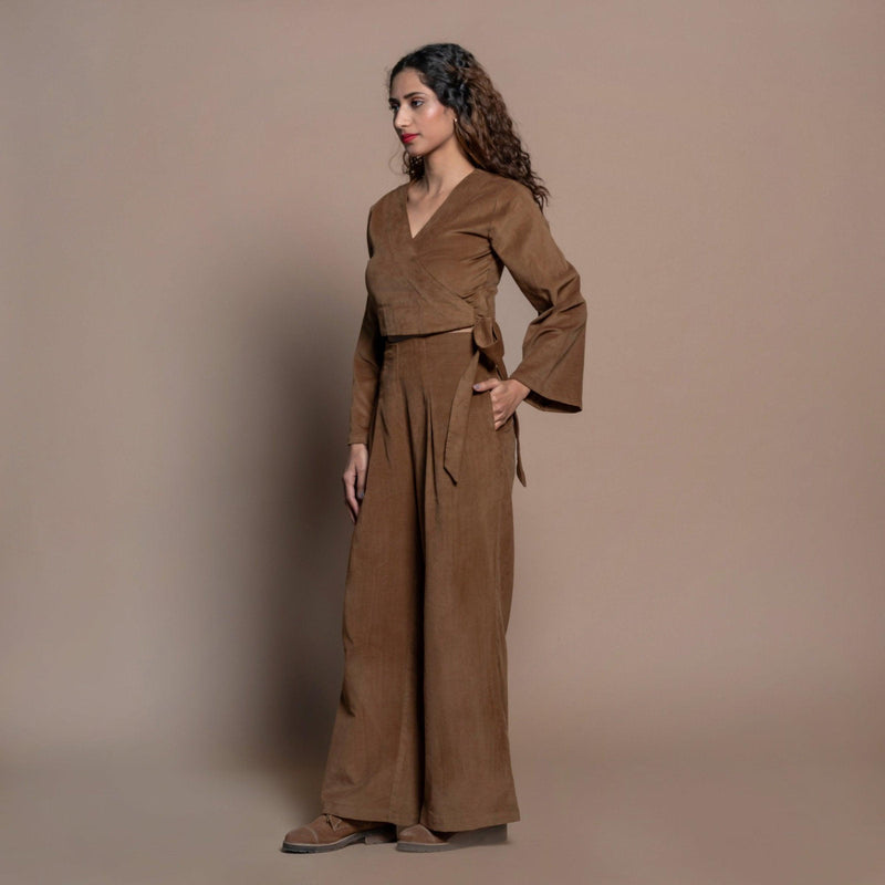 Left View of a Model wearing Camel Brown Cotton Velvet Elasticated Wide Legged Pant