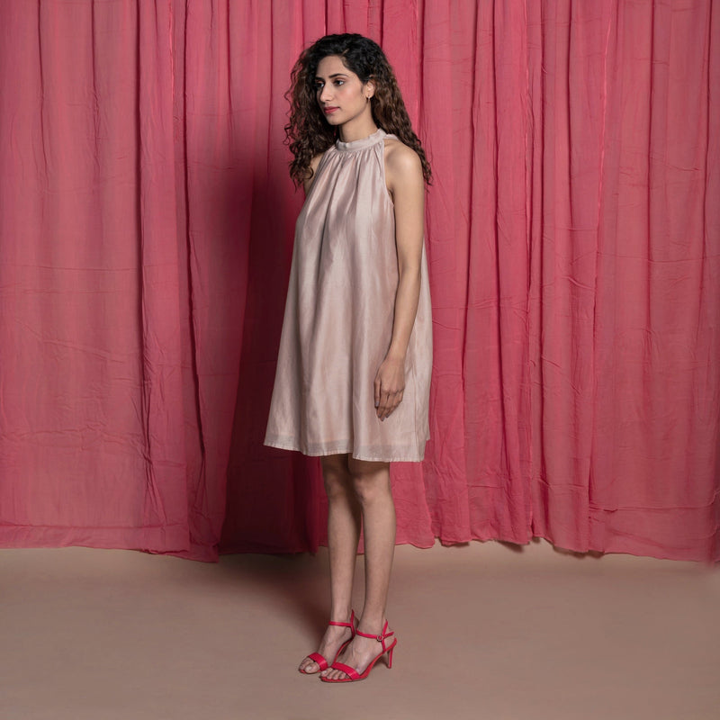 Left View of a Model wearing Champagne Cotton Chanderi Knee Length Tent Dress