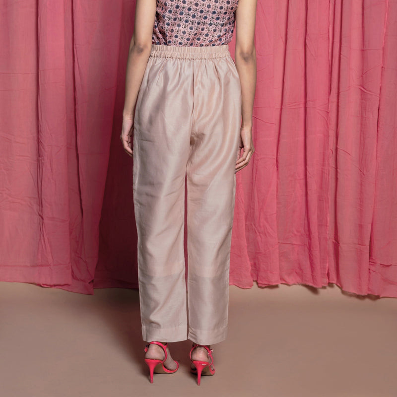 Back View of a Model wearing Champagne Cotton Chanderi Elasticated High-Rise Pant