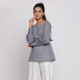 Left View of a Model wearing Charcoal Grey Cotton Flared Tunic Top