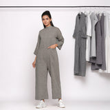 Front View of a Model wearing Charcoal Grey Handspun Straight Ankle Length Jumpsuit