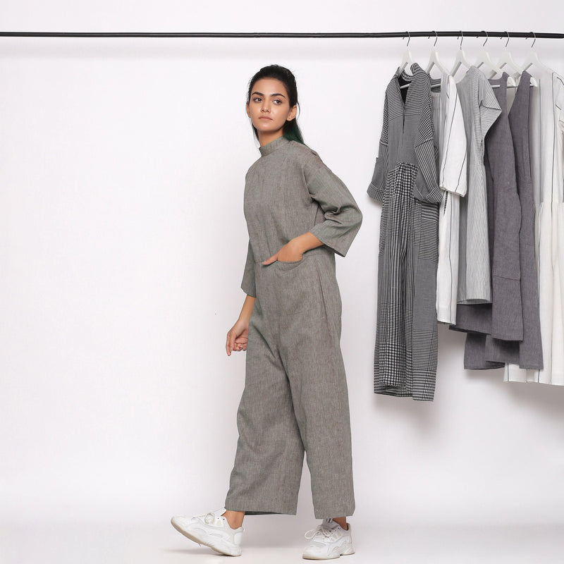 Left View of a Model wearing Charcoal Grey Handspun Straight Ankle Length Jumpsuit