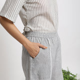Right Detail of a Model wearing Off-White Checkered Cotton Muslin Elasticated Mid-Rise Pant