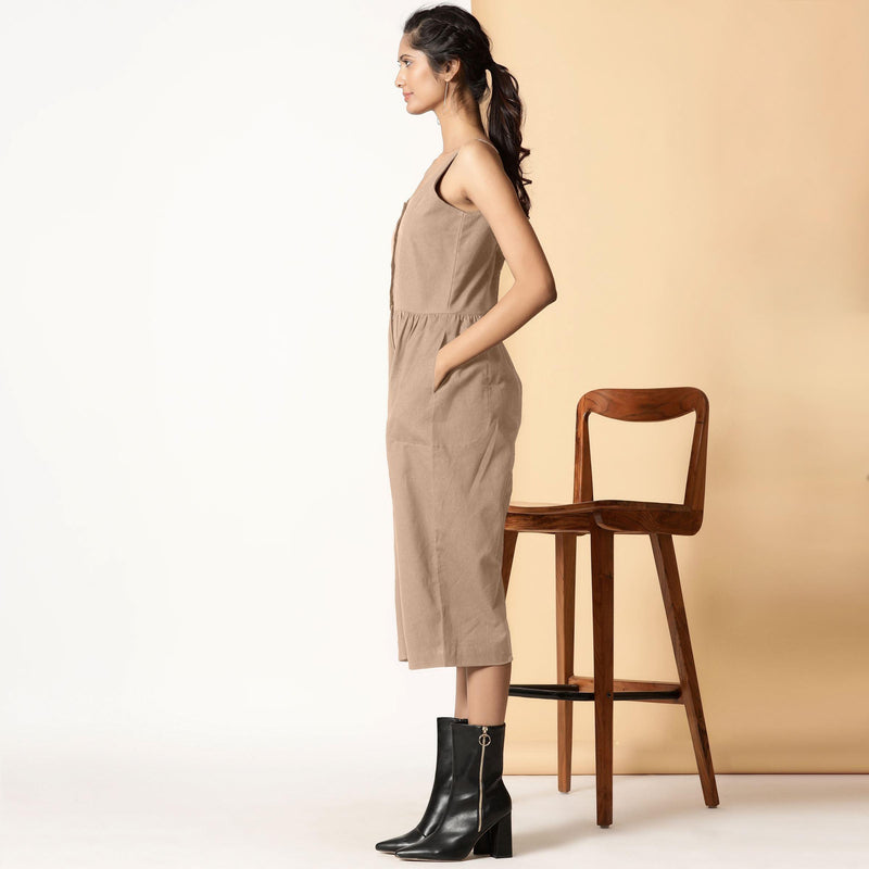 Left View of a Model wearing Beige Cotton Flax Button-Down Midi Jumpsuit