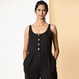 Front Detail of a Model wearing Chic Black Cotton Button-Down Jumpsuit