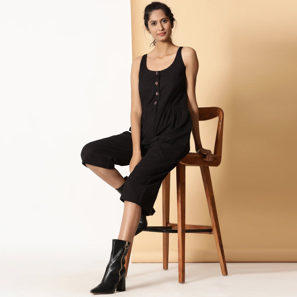Front View of a Model wearing Chic Black Cotton Button-Down Jumpsuit