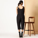 Back View of a Model wearing Chic Black Cotton Button-Down Jumpsuit