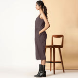 Left View of a Model wearing Brown Cotton Flax Button-Down Midi Jumpsuit