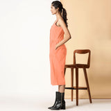 Left View of a Model wearing Peach Cotton Flax Button-Down Midi Jumpsuit
