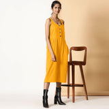 Right View of a Model wearing Yellow Cotton Flax Button-Down Midi Jumpsuit