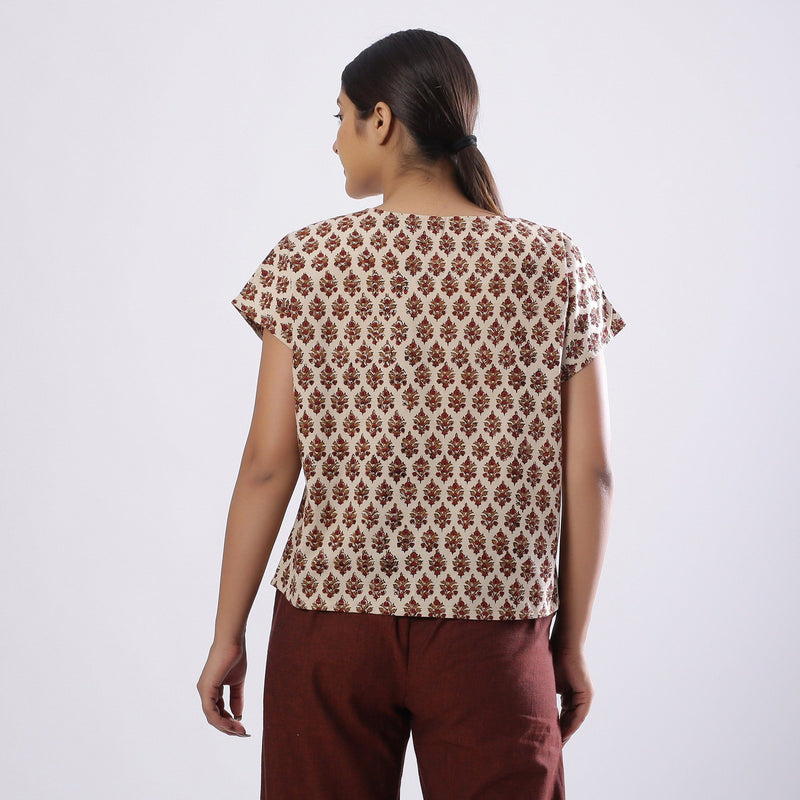 Back View of a Model wearing Beige Block Print Floral Loose Fit Top
