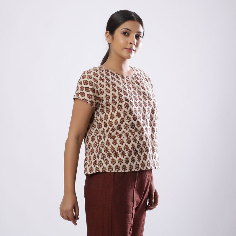 Right View of a Model wearing Beige Block Print Floral Loose Fit Top