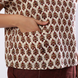 Close View of a Model wearing Beige Block Print Floral Loose Fit Top