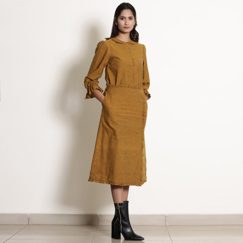 Right View of a Model wearing Classy Golden Oak Shirt and A-Line Skirt Set