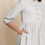 Front Detail of a Model wearing Cloudy Grey Button Down Gathered Dress