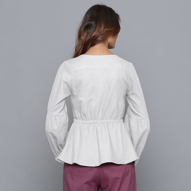 Back View of a Model wearing Cloudy Grey V-Neck Flannel Peplum Top