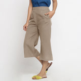 Left View of a Model wearing Comfort Fit Beige Cotton Flax Culottes