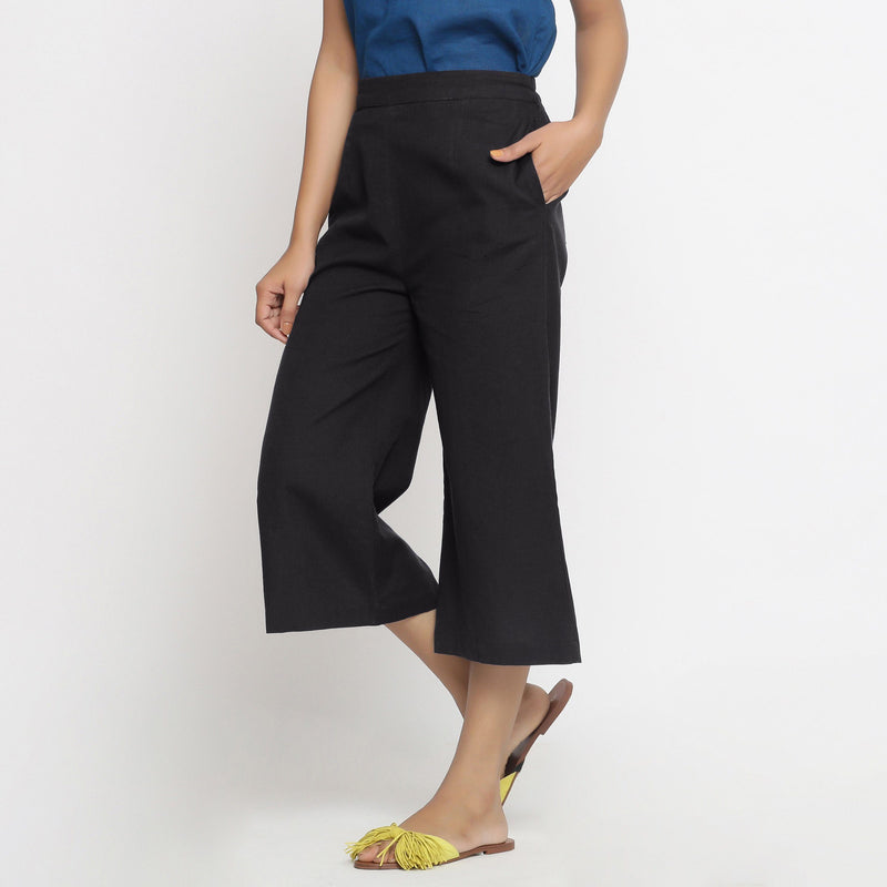 Left View of a Model wearing Comfort Fit Black Cotton Flax Culottes