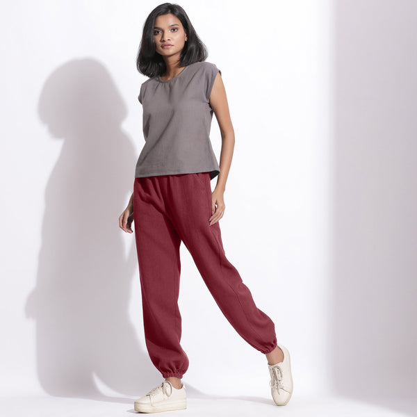 Front View of a Model wearing Comfy Barn Red Cotton Waffle Jogger Pants