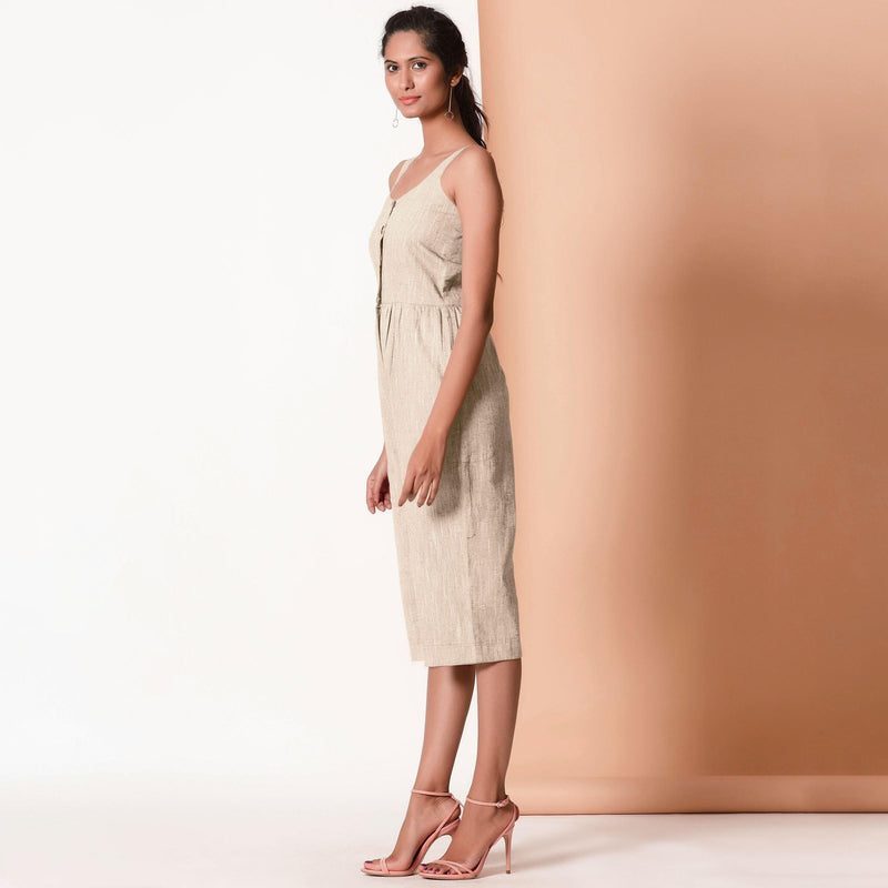 Left View of a Model wearing Beige Cotton Sleeveless Button-Down Jumpsuit