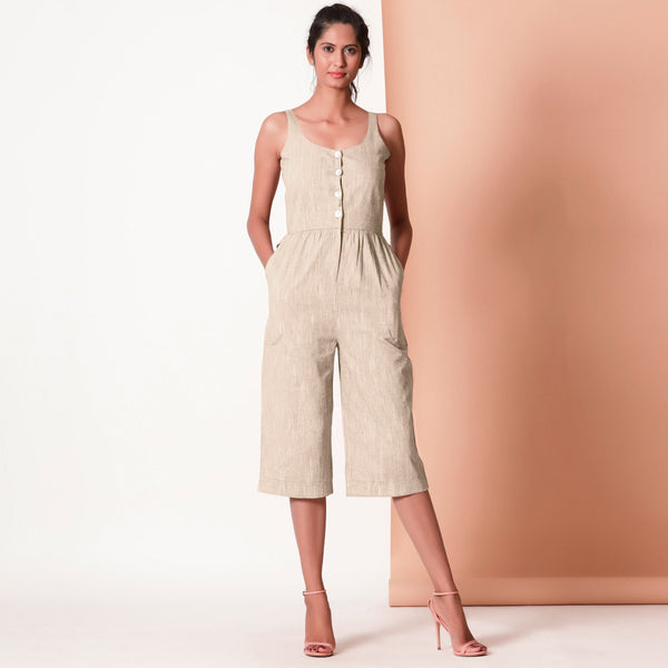 Front View of a Model wearing Beige Cotton Sleeveless Button-Down Jumpsuit