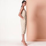 Right View of a Model wearing Beige Cotton Sleeveless Button-Down Jumpsuit