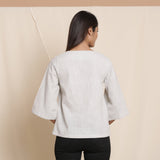 Back View of a Model wearing Cloudy Grey 100% Cotton Loose Fit V-Neck Top